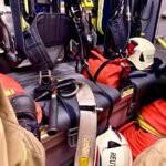 black and orange backpack on black car seat